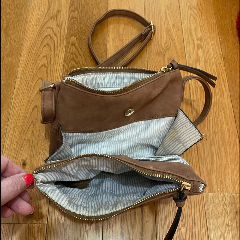 Suede, dark tan, multi pockets, gold zippers.